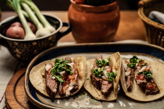 pexels-photo-7613561-7613561 Three mouth-watering steak tacos topped with cilantro and onions on a rustic table setting.