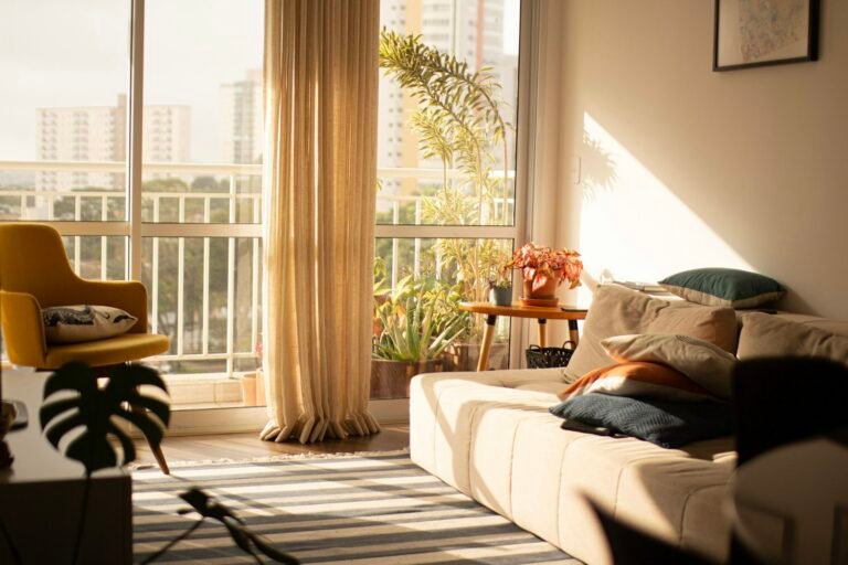 Bright living room with a large window in a cosy rented apartment