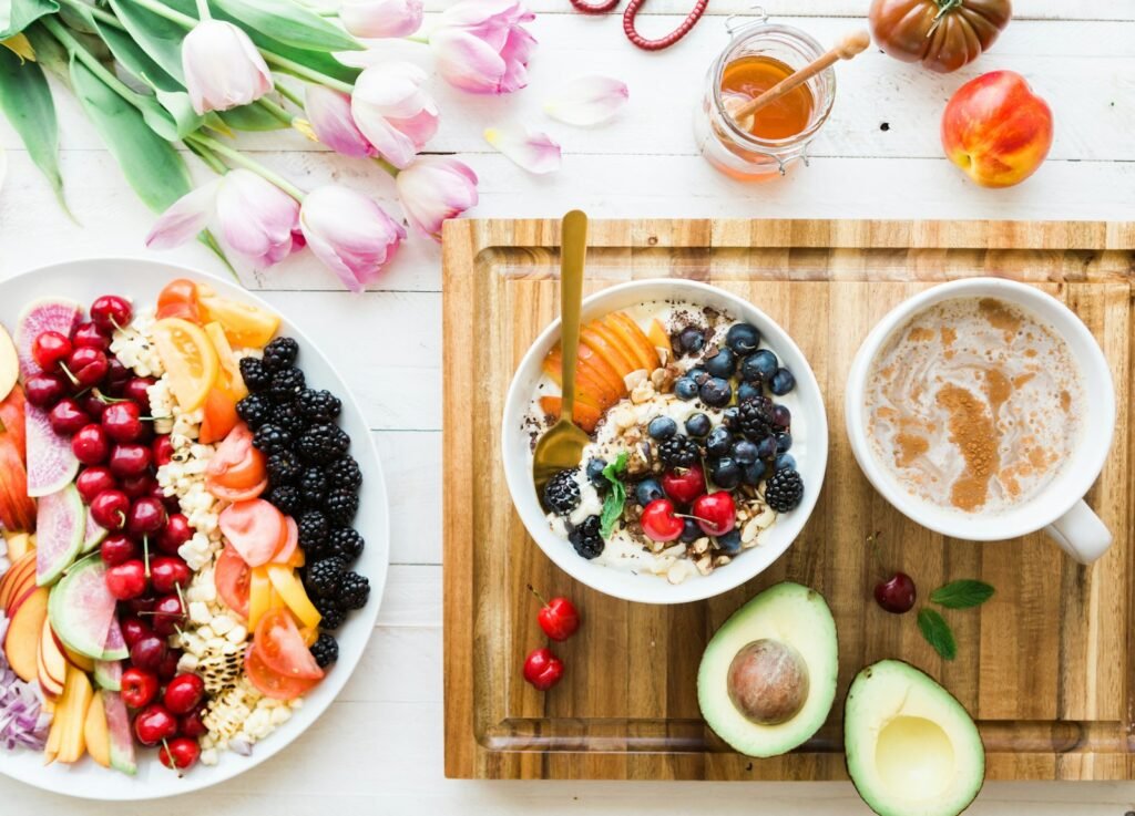 Coffee and breakfast on a table while planning a budget